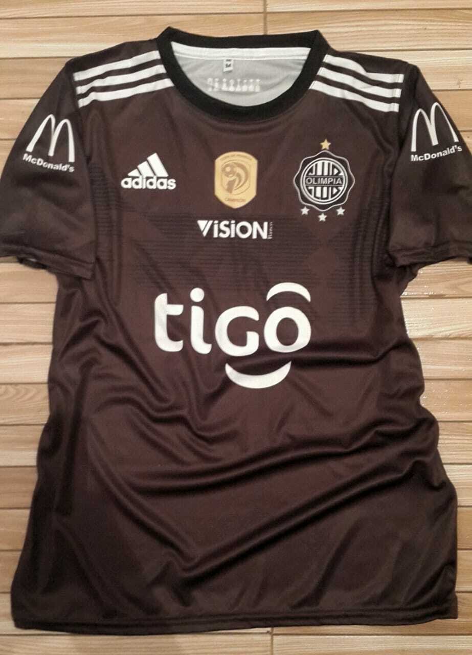 Resistente Estallar Deportista Club Olimpia Visitante Camiseta de Fútbol 2019. Sponsored by Tigo