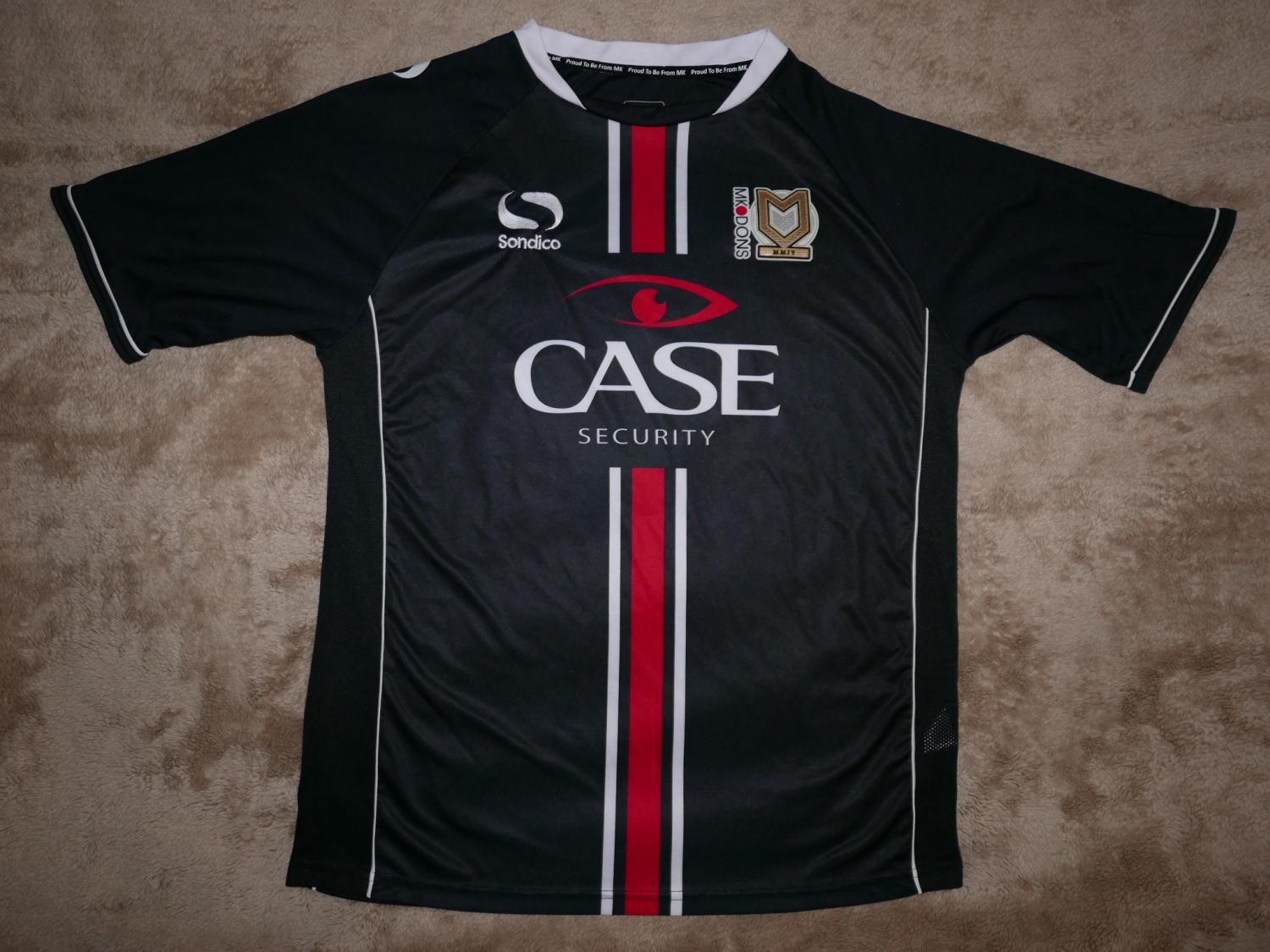Milton Keynes Dons Away football shirt 2013 2014. Sponsored by Case Security
