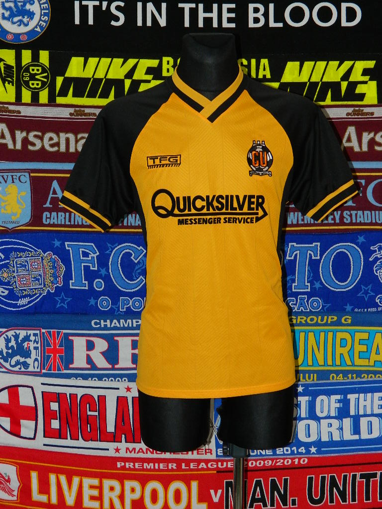 Cambridge United Home football shirt 2001 - 2003. Sponsored by Quicksilver Messenger Service